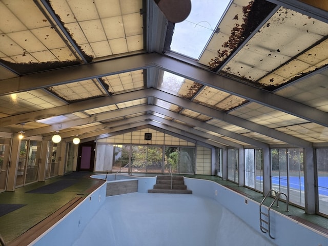 view of pool with a skylight