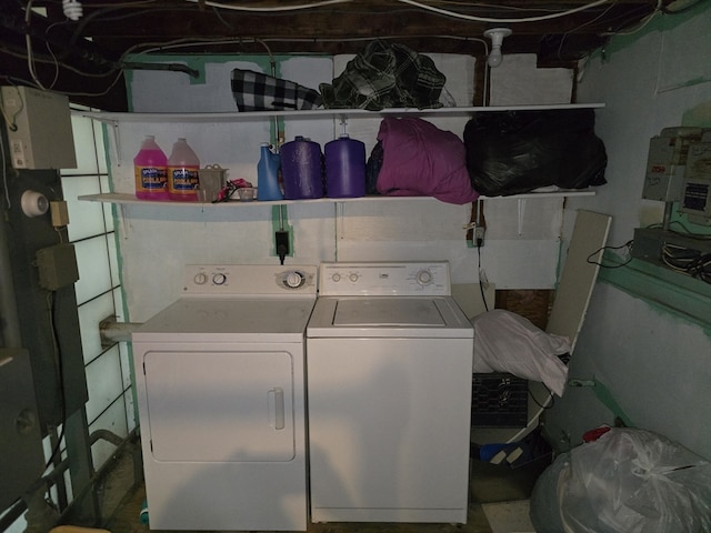 clothes washing area with washer and clothes dryer