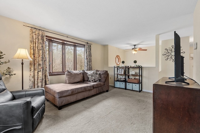 living room featuring light colored carpet and ceiling fan