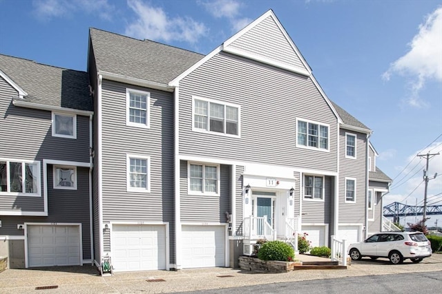 700 Shore Dr Unit 1106, Fall River, MA 02721 - view of property with an attached garage and a shingled roof