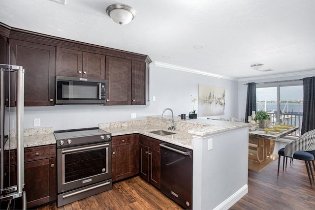 700 Shore Dr Unit 1106, Fall River, MA 02721 - kitchen with stainless steel appliances, dark wood-style flooring, a peninsula, ornamental molding, and dark brown cabinetry
