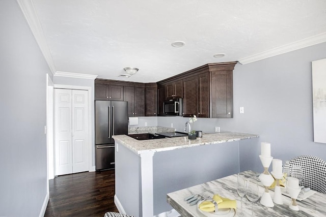 700 Shore Dr Unit 1106, Fall River, MA 02721 - kitchen with stainless steel appliances, dark brown cabinets, light stone countertops, crown molding, and dark wood finished floors