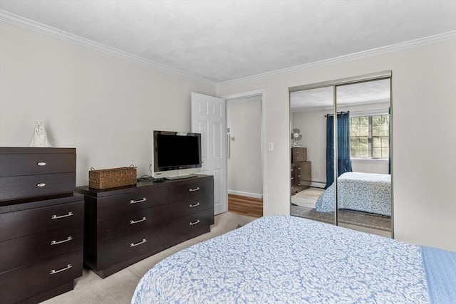 358 Broadway Unit 20, Lynn, MA 01904 - bedroom featuring ornamental molding, a closet, and light colored carpet