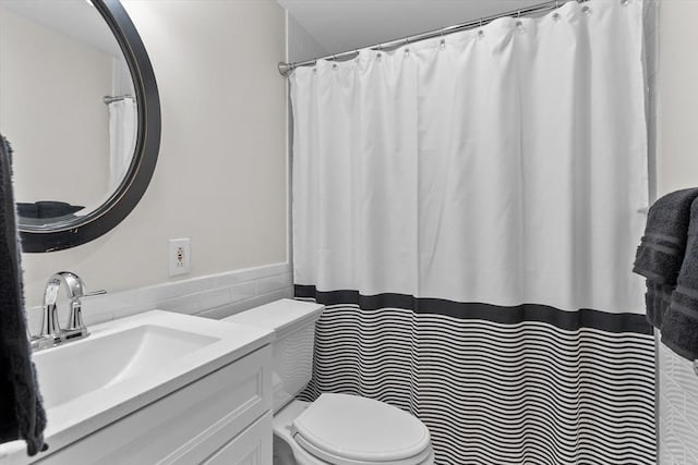 358 Broadway Unit 20, Lynn, MA 01904 - bathroom with toilet, vanity, tile walls, and a shower with curtain