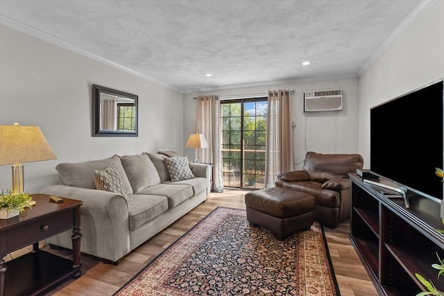 358 Broadway Unit 20, Lynn, MA 01904 - living room with a wall unit AC, ornamental molding, wood finished floors, a textured ceiling, and recessed lighting
