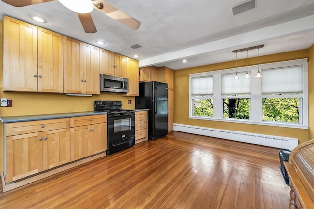 4 3rd Rd, Woburn, MA 01801 - kitchen with black appliances, baseboard heating, a ceiling fan, hanging light fixtures, and wood finished floors