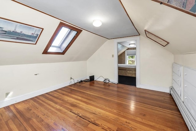 4 3rd Rd, Woburn, MA 01801 - additional living space featuring a baseboard heating unit, a skylight, wood finished floors, and vaulted ceiling