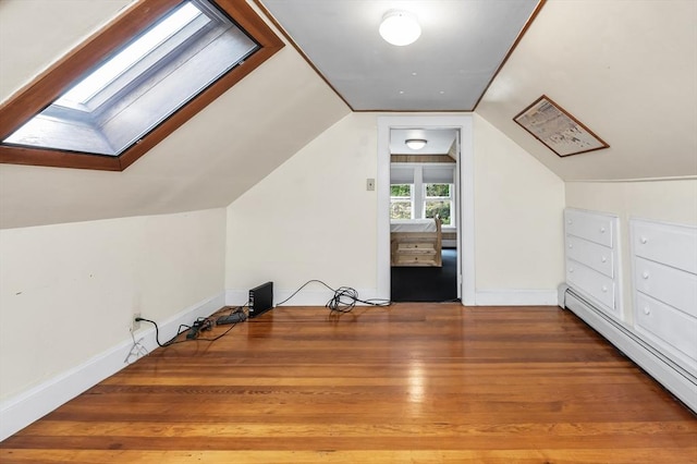 4 3rd Rd, Woburn, MA 01801 - bonus room featuring a skylight, wood finished floors, vaulted ceiling, and baseboard heating