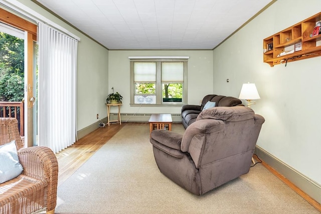 4 3rd Rd, Woburn, MA 01801 - living area with plenty of natural light, ornamental molding, wood finished floors, and baseboard heating
