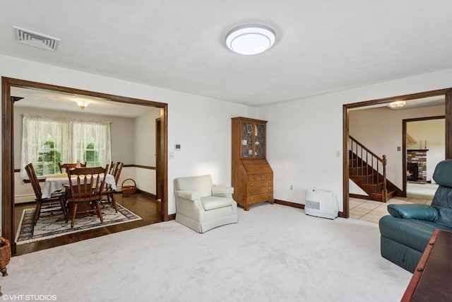 20 Lucia Dr, Milford, MA 01757 - carpeted living room featuring baseboards and a fireplace
