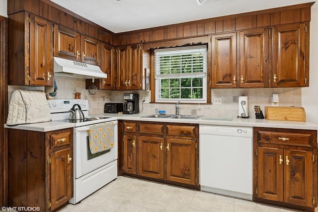 20 Lucia Dr, Milford, MA 01757 - kitchen featuring white appliances, under cabinet range hood, light countertops, and backsplash