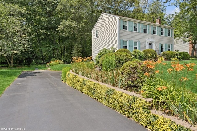 20 Lucia Dr, Milford, MA 01757 - colonial home with a chimney and a front yard