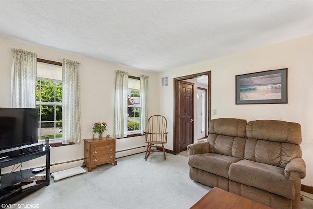 20 Lucia Dr, Milford, MA 01757 - carpeted living area featuring plenty of natural light and a baseboard heating unit