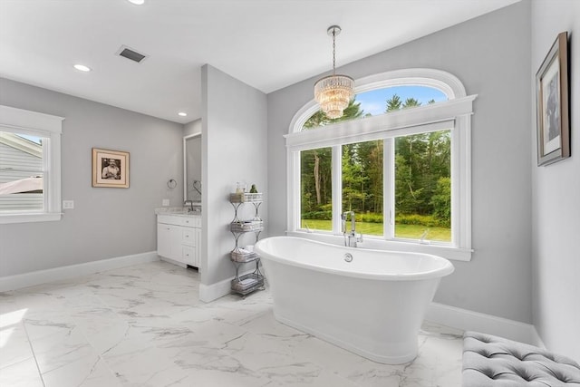 bathroom with baseboards, marble finish floor, and visible vents