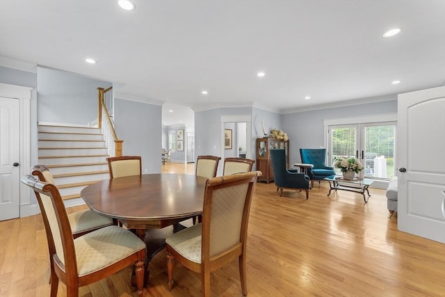 dining room with recessed lighting, stairway, crown molding, and light wood finished floors