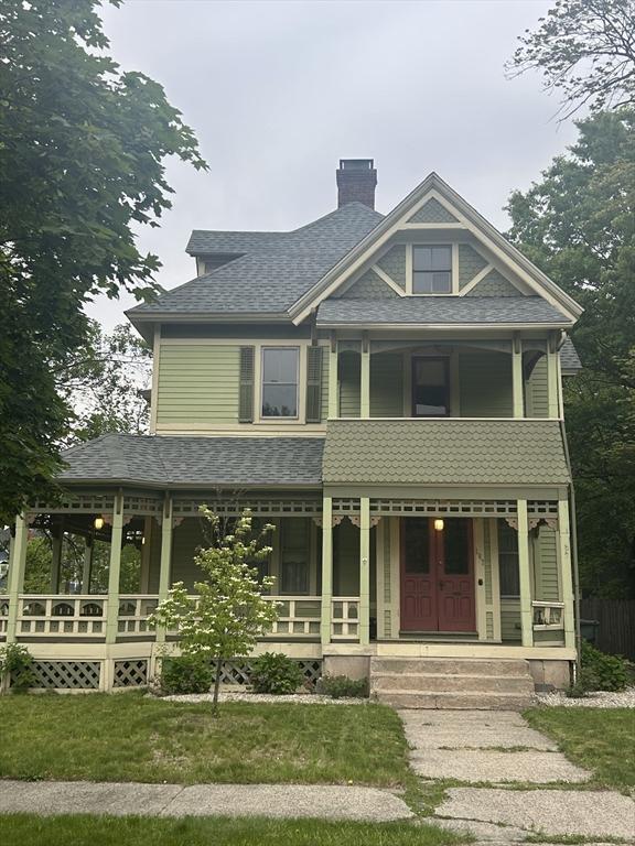 107 Dartmouth, Springfield, MA 01109 - victorian house featuring a porch, a chimney, and roof with shingles
