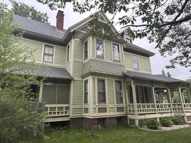 107 Dartmouth, Springfield, MA 01109 - rear view of house with a wooden deck, a sunroom, a yard, a chimney, and roof with shingles