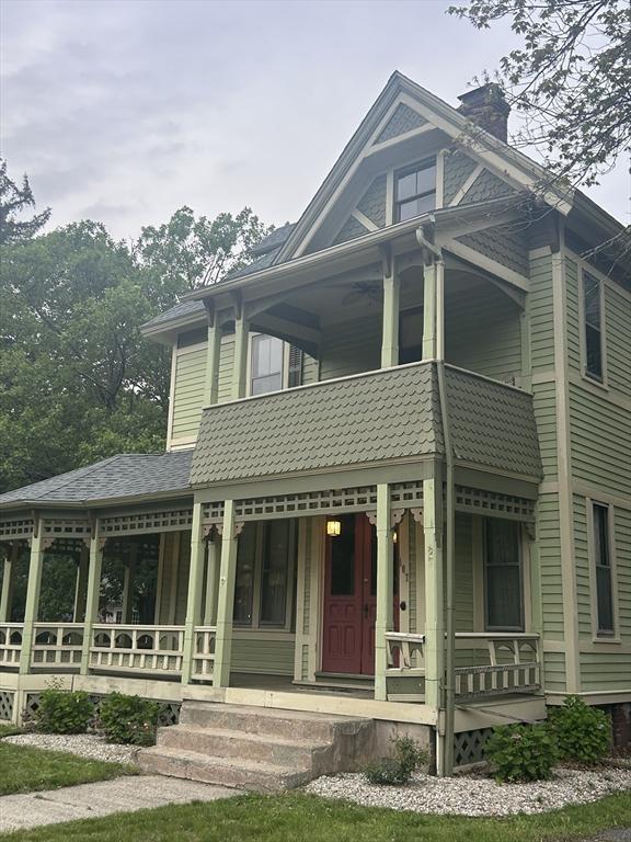 107 Dartmouth, Springfield, MA 01109 - victorian house with covered porch, a balcony, and a chimney