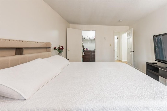 bedroom with a walk in closet