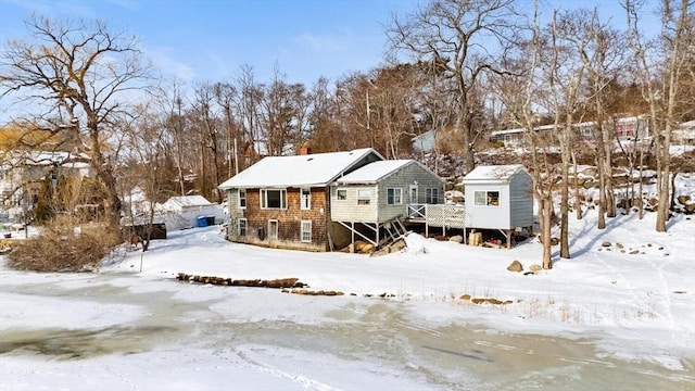 exterior space with a deck and a storage shed