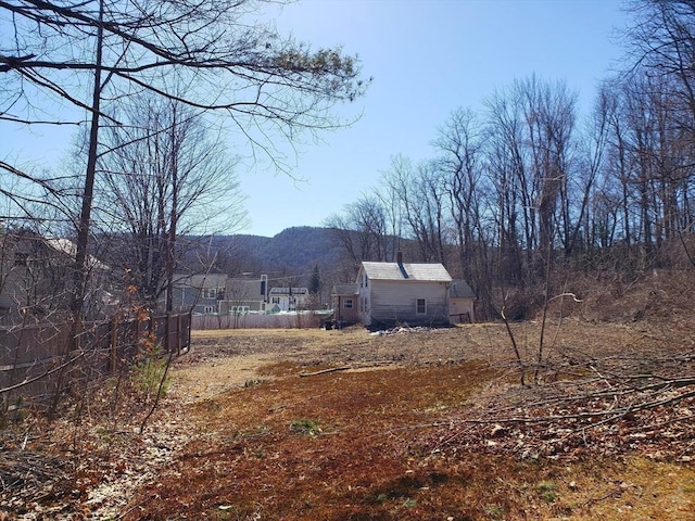 view of yard featuring a wooded view