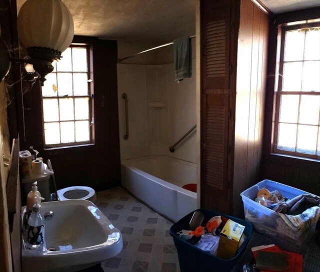 bathroom with a sink, shower / bathtub combination, and tile patterned floors