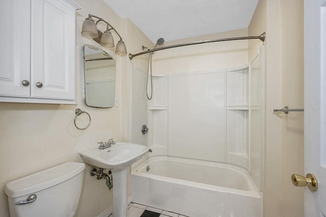 bathroom featuring bathtub / shower combination and toilet