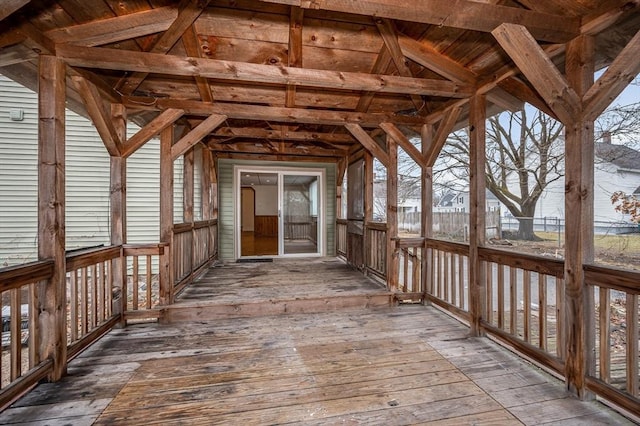 exterior space with vaulted ceiling