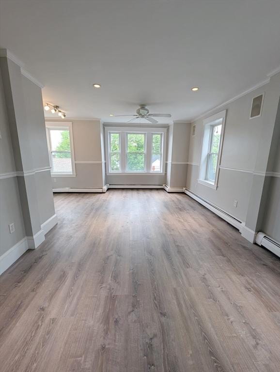 16 Horton St Unit 2, Salem, MA 01970 - unfurnished living room featuring crown molding, healthy amount of natural light, wood finished floors, baseboards, and recessed lighting