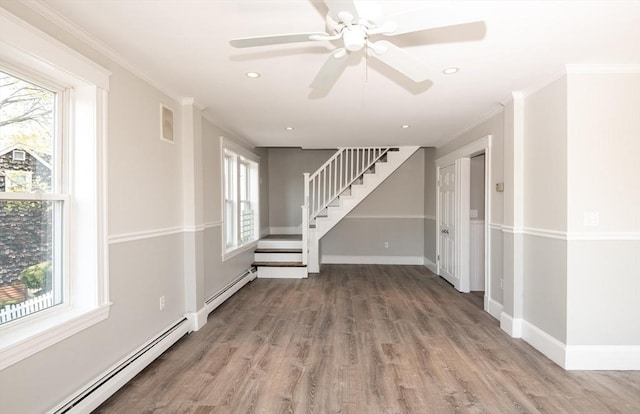 16 Horton St Unit 2, Salem, MA 01970 - spare room with a baseboard radiator, stairs, wood finished floors, recessed lighting, and crown molding