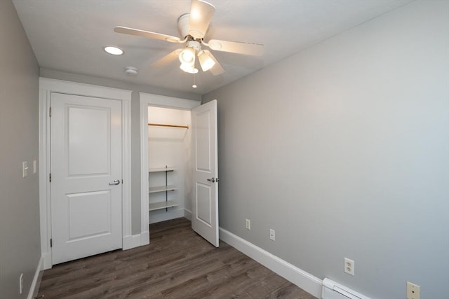 16 Horton St Unit 2, Salem, MA 01970 - unfurnished bedroom featuring dark wood-style floors, baseboards, a closet, a ceiling fan, and baseboard heating