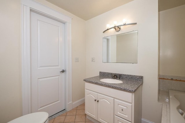 16 Horton St Unit 2, Salem, MA 01970 - bathroom with tile patterned flooring, vanity, toilet, a tub, and baseboards