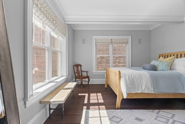 bedroom with baseboards, multiple windows, ornamental molding, and dark wood-style floors