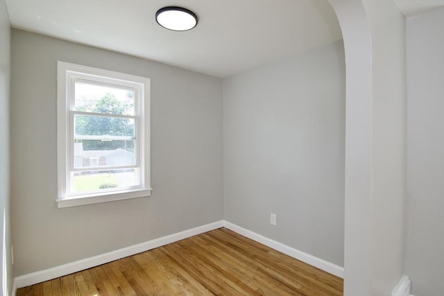 100 Haskin St, Springfield, MA 01109 - empty room featuring light wood-type flooring and arched walkways