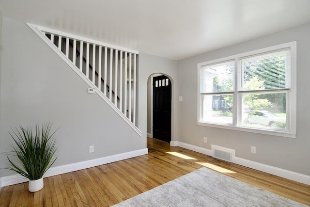 100 Haskin St, Springfield, MA 01109 - foyer entrance featuring arched walkways, wood finished floors, and stairway