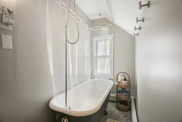 24 Everett St, Woburn, MA 01801 - bathroom with a soaking tub, lofted ceiling, a baseboard radiator, and baseboards