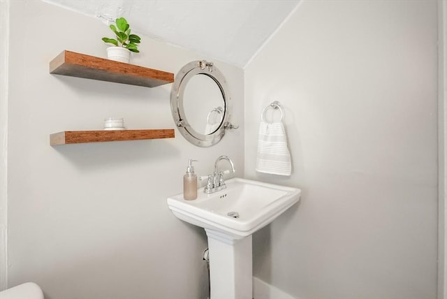 24 Everett St, Woburn, MA 01801 - half bath featuring vaulted ceiling