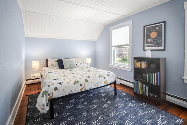 24 Everett St, Woburn, MA 01801 - bedroom featuring baseboard heating, wood finished floors, vaulted ceiling, and baseboards