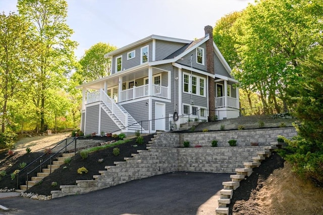 9 School St, Hull, MA 02045 - view of front facade featuring a porch, a chimney, and stairs
