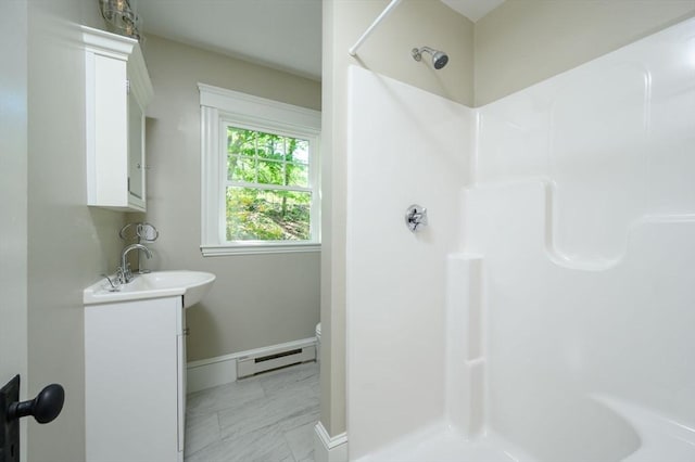 9 School St, Hull, MA 02045 - full bath featuring vanity, toilet, baseboards, a shower, and a baseboard heating unit