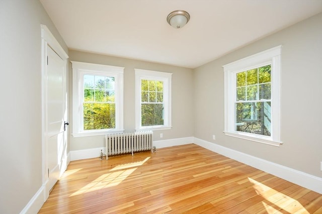 9 School St, Hull, MA 02045 - unfurnished room with baseboards, light wood-style floors, and radiator heating unit
