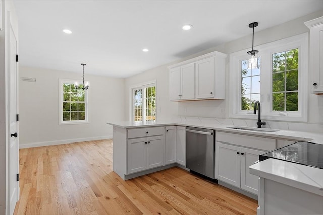 7 S Porter St Unit 7, Haverhill, MA 01835 - kitchen with stainless steel dishwasher, a peninsula, light wood finished floors, white cabinetry, and recessed lighting