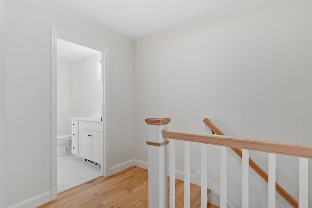 7 S Porter St Unit 7, Haverhill, MA 01835 - hallway featuring light wood-style flooring and an upstairs landing