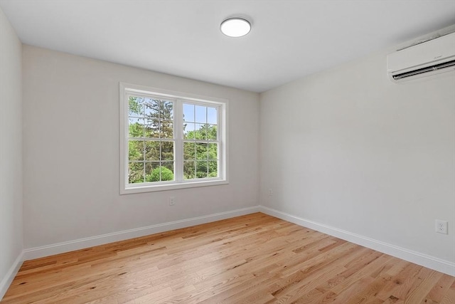 7 S Porter St Unit 7, Haverhill, MA 01835 - empty room with a wall mounted air conditioner and wood finished floors