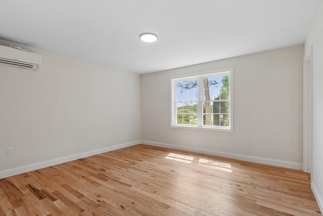 7 S Porter St Unit 7, Haverhill, MA 01835 - spare room with a wall mounted AC and light wood finished floors