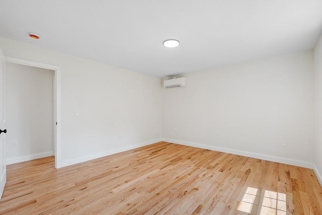 7 S Porter St Unit 7, Haverhill, MA 01835 - unfurnished room featuring a wall mounted AC and light wood-type flooring