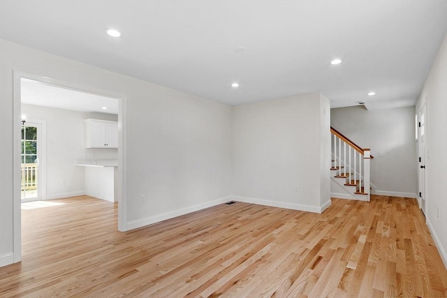7 S Porter St Unit 7, Haverhill, MA 01835 - unfurnished room with light wood-style floors, stairway, and recessed lighting