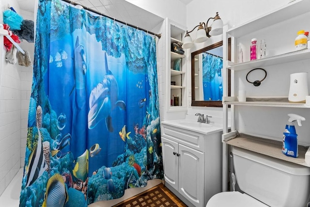 bathroom featuring curtained shower, toilet, and vanity