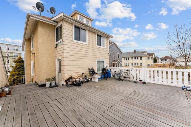 wooden terrace with a residential view