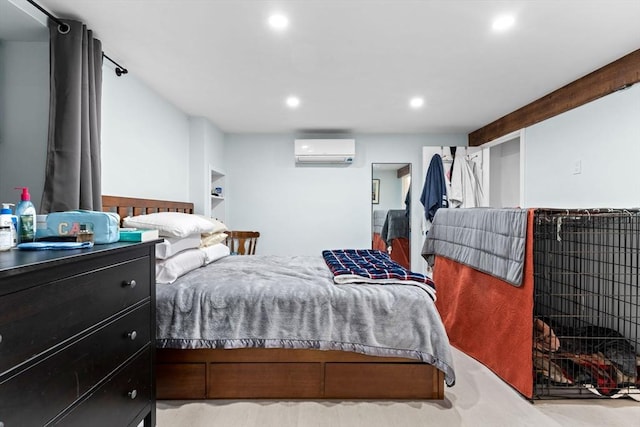 bedroom featuring recessed lighting and an AC wall unit